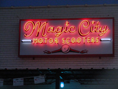 Neon sign atop Magic City Motor Scooters